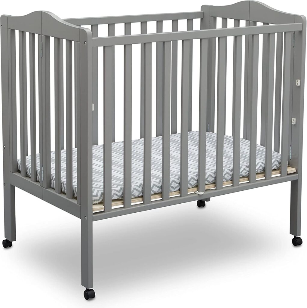 affordable cribs under $150 Delta Children Folding Portable Mini Baby Crib with Mattress