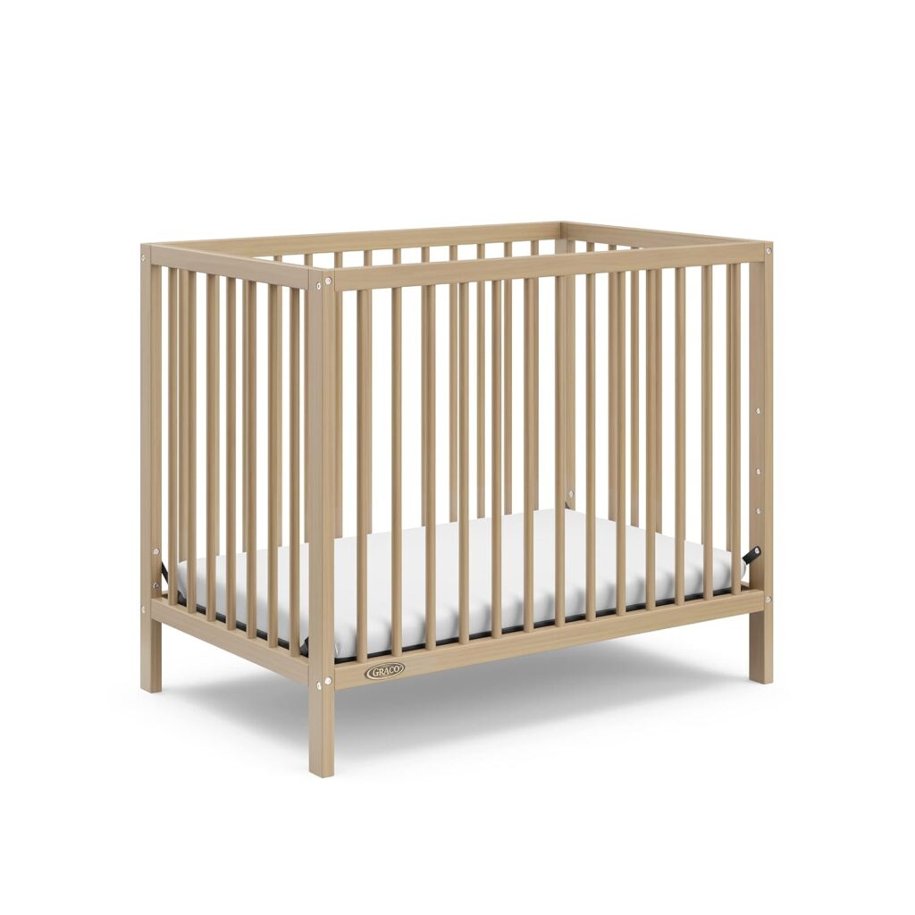 affordable cribs under $150 Graco Teddi 4-in-1 Convertible Mini Crib with Bonus Mattress